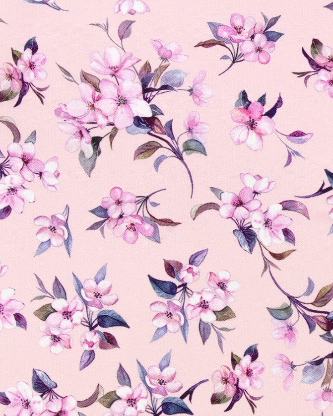 A repeating watercolor floral pattern of pink blossoms and leaves on a soft blush pink background.