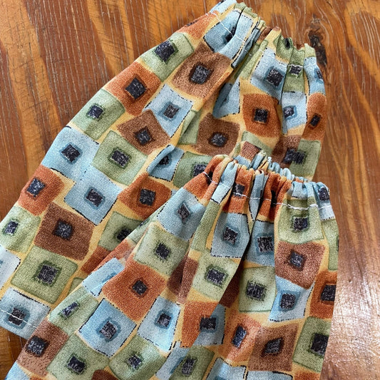 Folded sock savers on a wooden surface